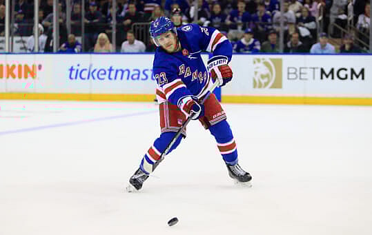 New York Rangers defenseman Adam Fox (23) passes the puck against the Tampa Bay Lightning in the first period of game one of the Eastern Conference Final of the 2022 Stanley Cup Playoffs at Madison Square Garden