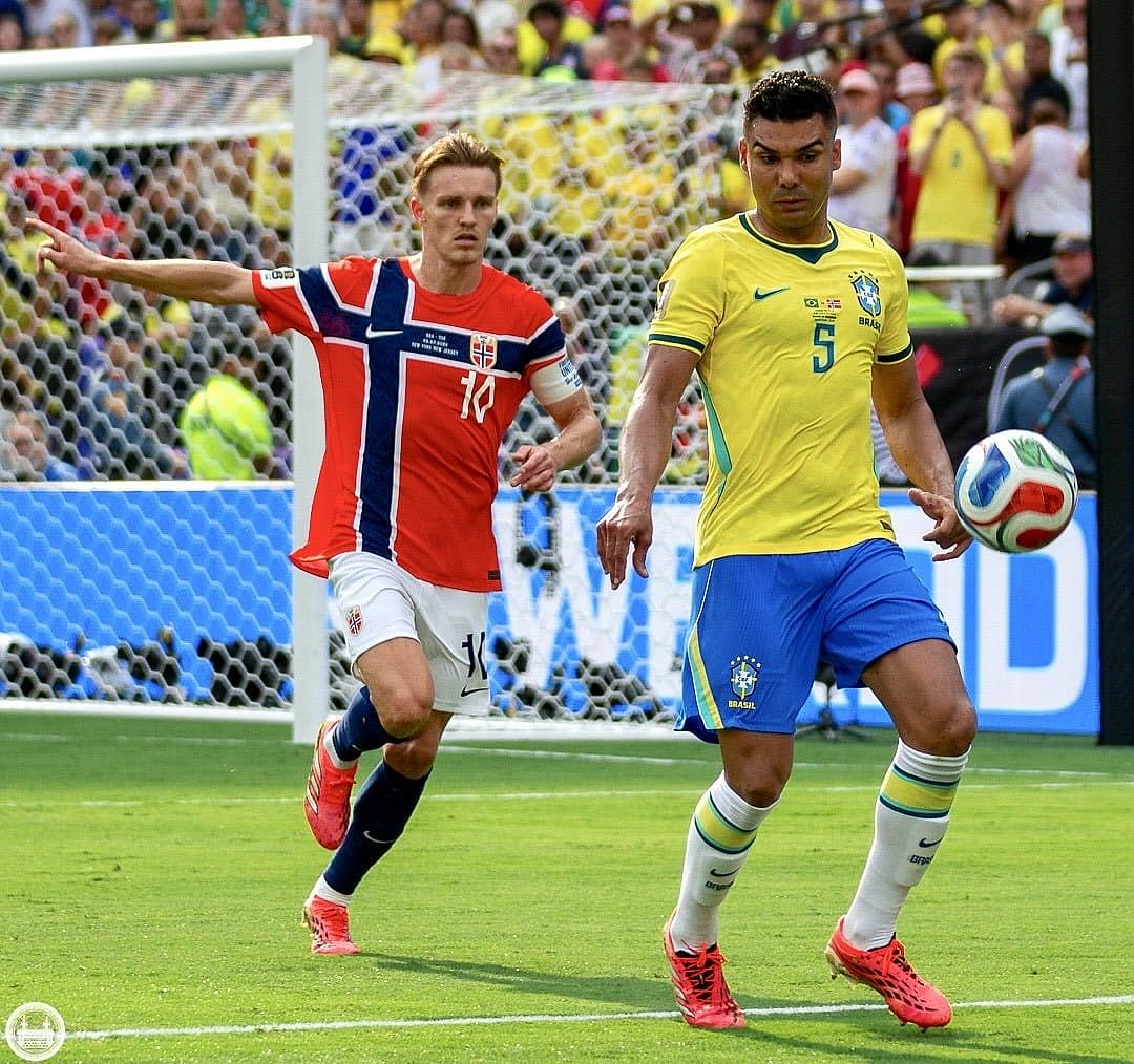 Martin Odegaard tracks Casemiro during Norway against Brazil at the World Cup