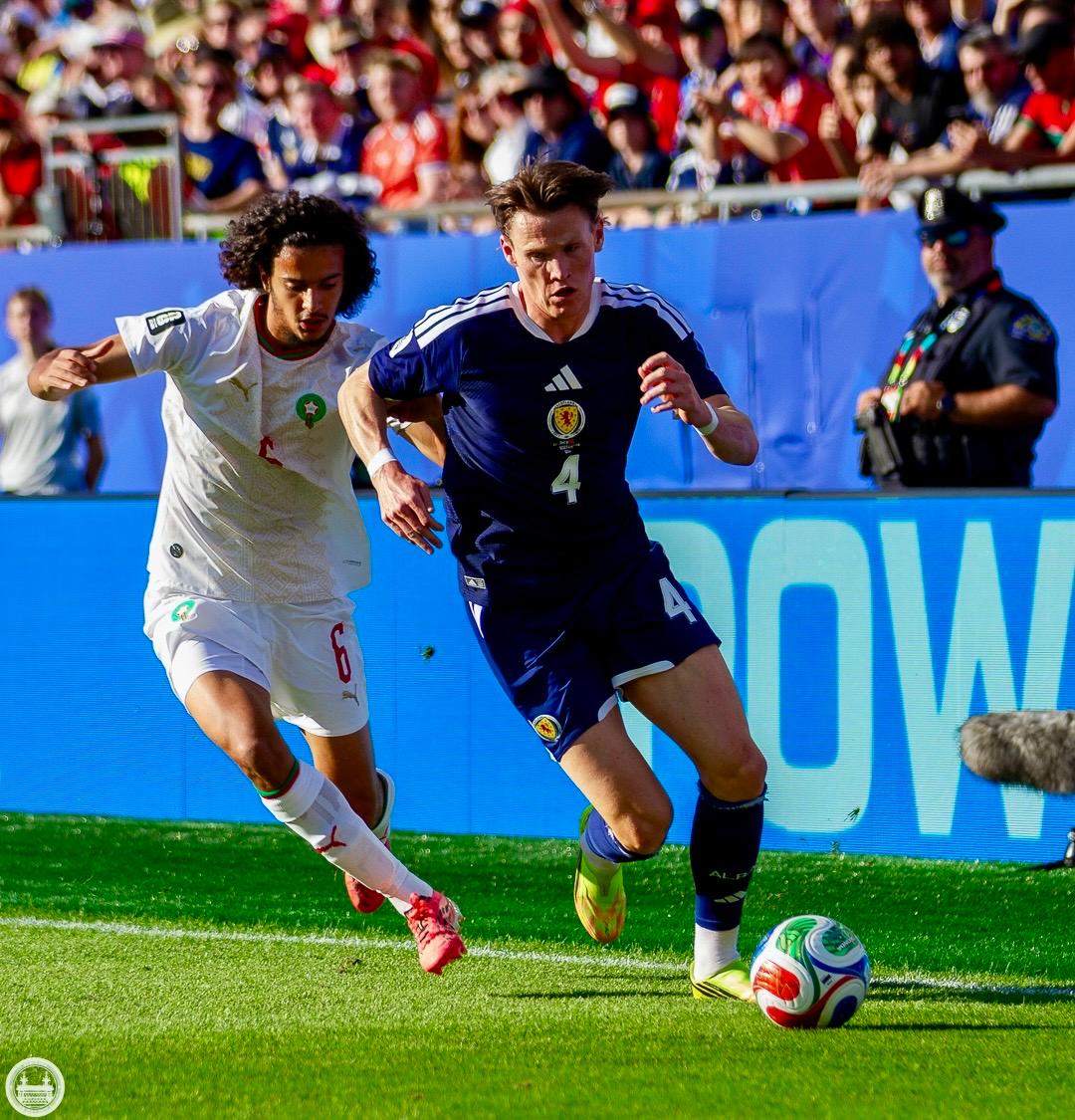 Scott McTominay carrying the ball for Scotland against Morocco