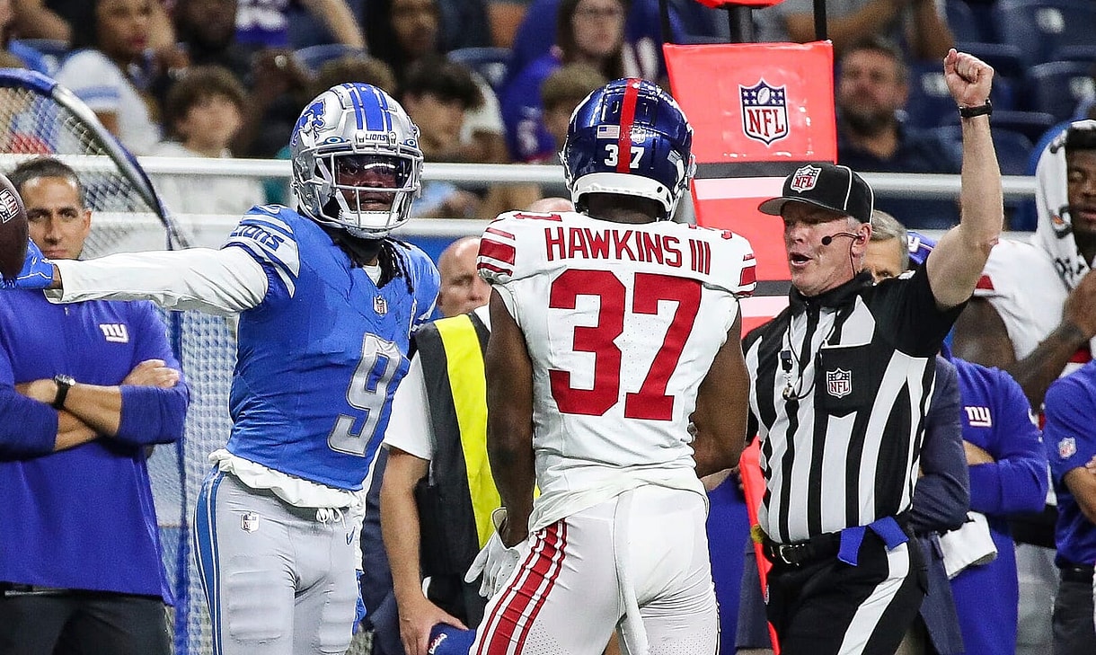 Detroit Lions wide receiver Jameson Williams (9) reacts to a first down catch against New York Giants cornerback Tre Hawkins III (37) during the first half of a preseason game at Ford Field in Detroit on Friday
