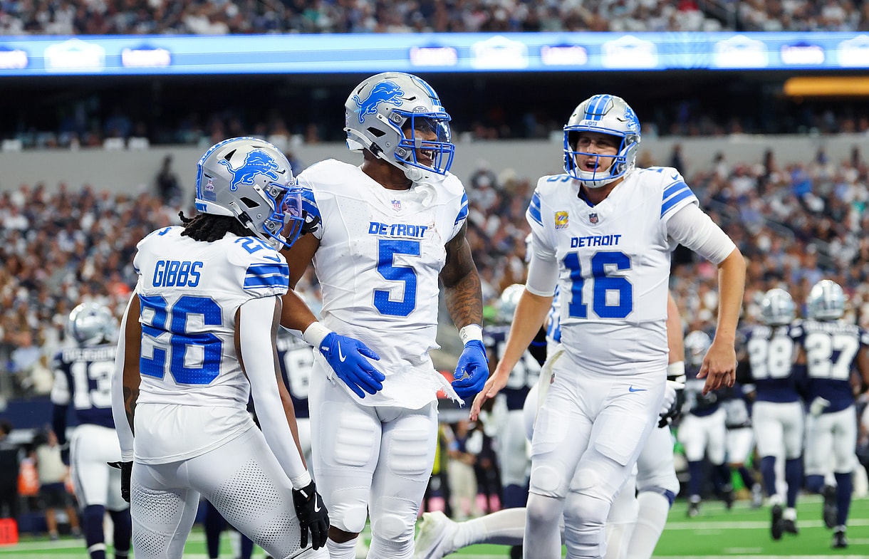 Oct 13, 2024; Arlington, Texas, USA; Detroit Lions running back David Montgomery (5) celebrates with Detroit Lions quarterback Jared Goff (16) and Detroit Lions running back Jahmyr Gibbs (26) after a touchdown during the first quarter against the Dallas Cowboys at AT&T Stadium. Mandatory Credit: Kevin Jairaj-Imagn Images