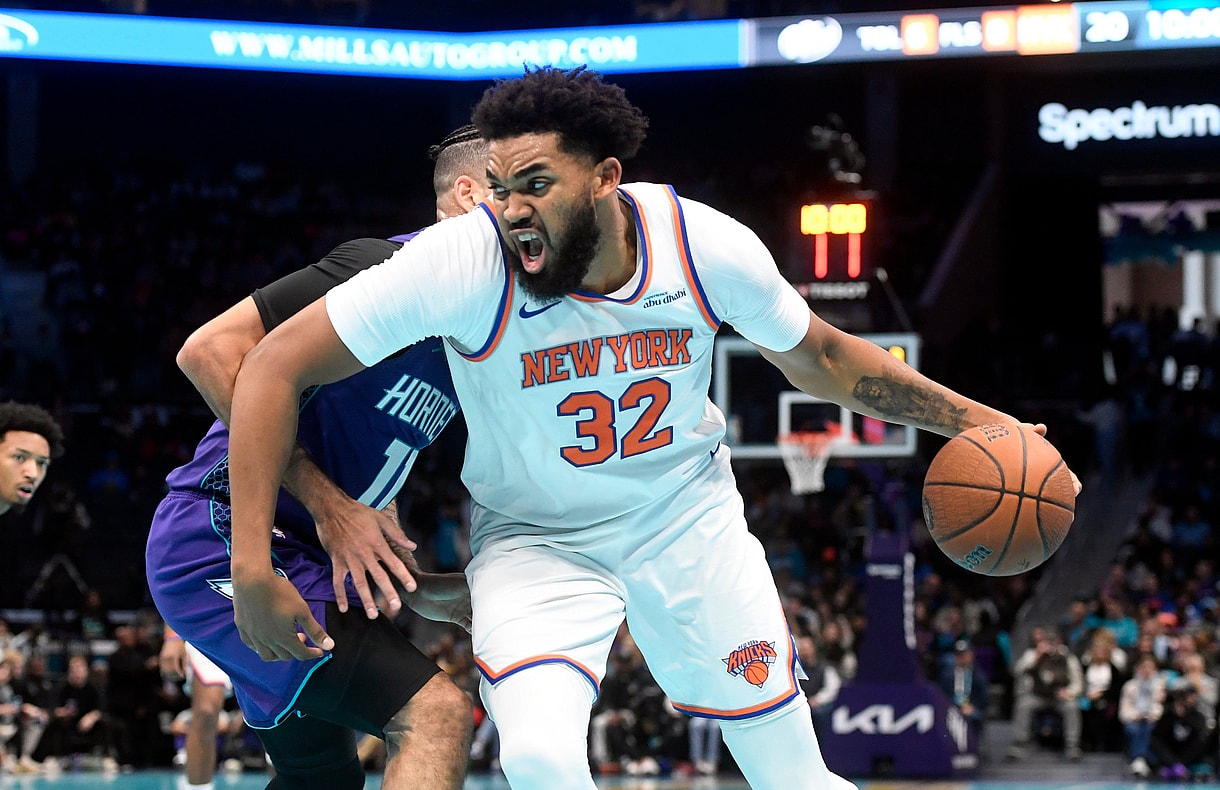Nov 29, 2024; Charlotte, North Carolina, USA; New York Knicks center Karl-Anthony Towns (32) drives in during the first half against the Charlotte Hornets at the Spectrum Center. Mandatory Credit: Sam Sharpe-Imagn Images