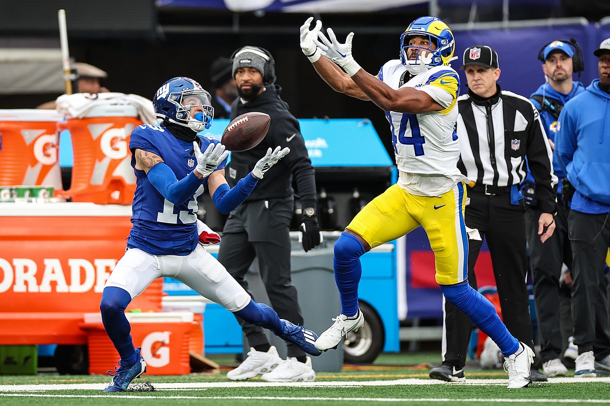 New York Giants wide receiver Jalin Hyatt (13) attempts to catch a pass as Los Angeles Rams cornerback Ahkello Witherspoon (44) defends during the first half at MetLife Stadium