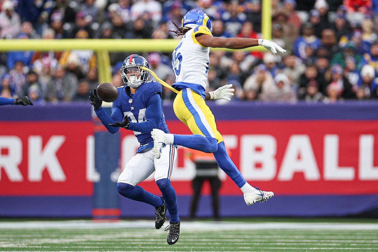 New York Giants safety Dane Belton (24) intercepts a pass intended for Los Angeles Rams wide receiver Demarcus Robinson (15) during the second half at MetLife Stadium