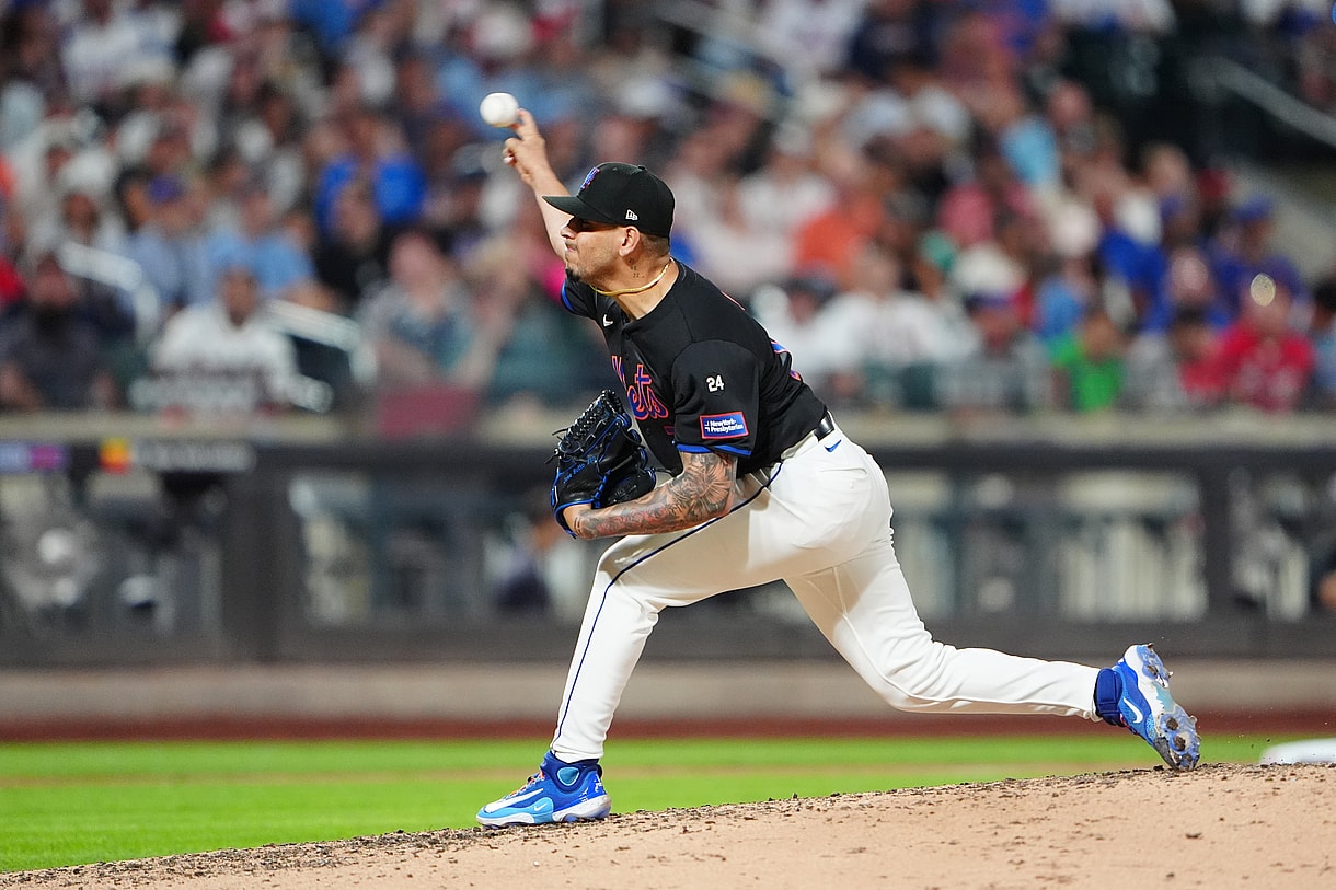 Jul 25, 2024; New York City, New York, USA; New York Mets pitcher Jose Butto (70) delivers a pitch against the Atlanta Braves during the sixth inning at Citi Field. Mandatory Credit: Gregory Fisher-USA TODAY Sports