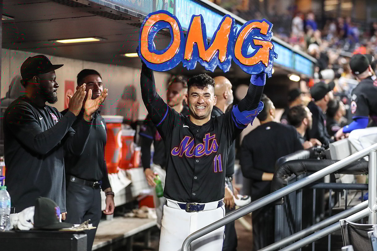 Jul 12, 2024; New York City, New York, USA;  New York Mets second baseman Jose Iglesias (11) celebrates in the dugout after hitting a solo home run in the fifth inning against the Colorado Rockies at Citi Field. Mandatory Credit: Wendell Cruz-USA TODAY Sports