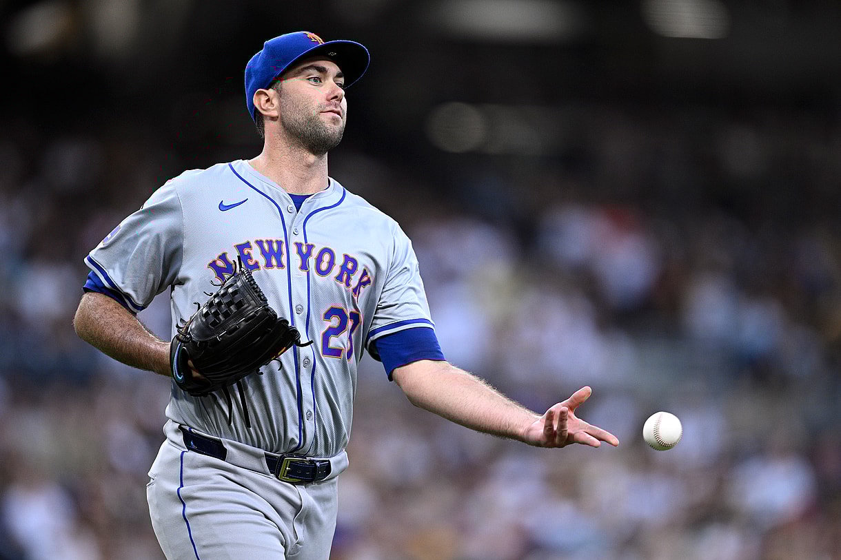 Aug 24, 2024; San Diego, California, USA; New York Mets starting pitcher David Peterson (23) tosses the ball to first base during the fifth inning against the San Diego Padres at Petco Park. Mandatory Credit: Orlando Ramirez-USA TODAY Sports