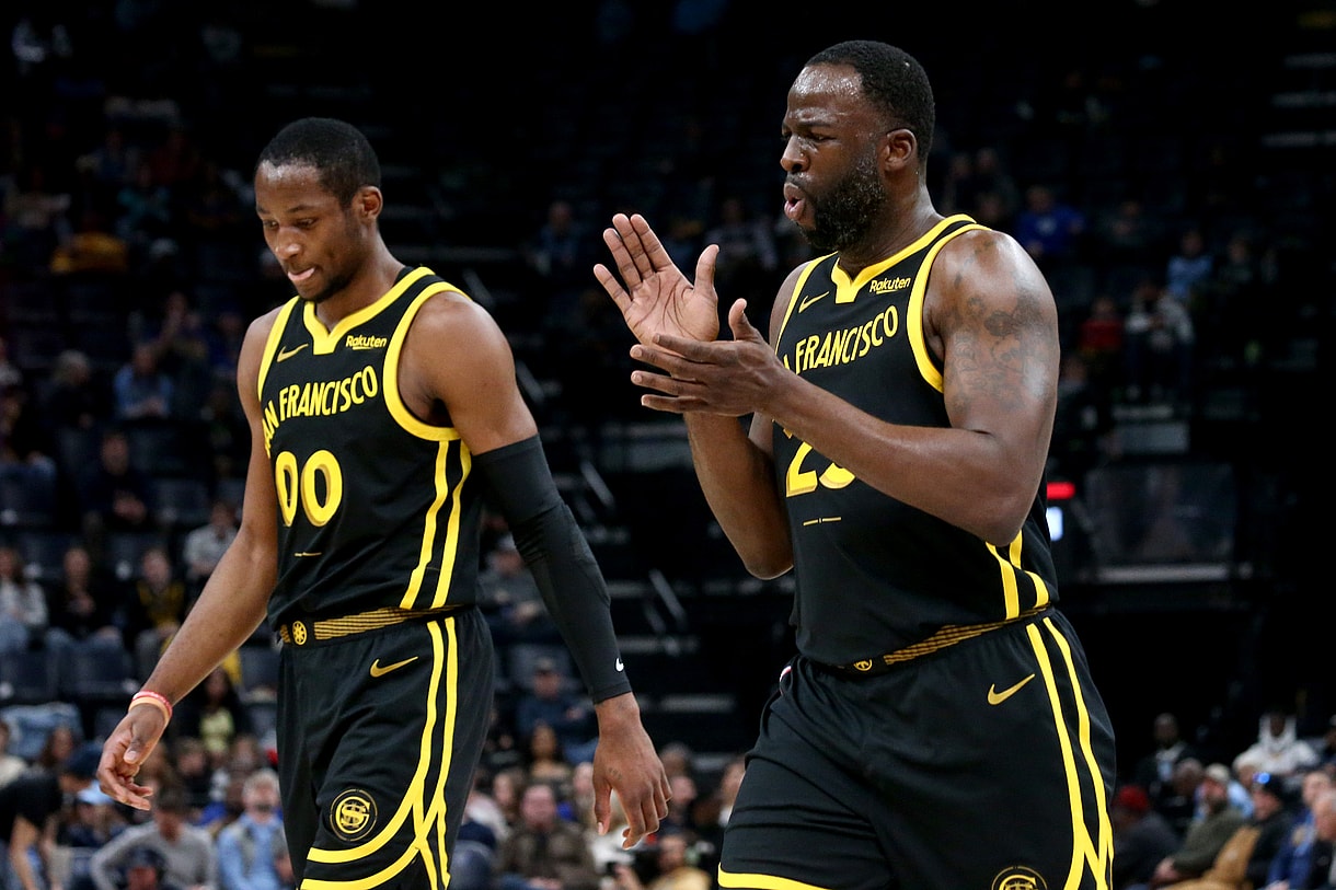 Jan 15, 2024; Memphis, Tennessee, USA; Golden State Warriors forward Jonathan Kuminga (00) and Golden State Warriors forward Draymond Green (23) walk to the bench at the end of the first quarter against the Memphis Grizzlies at FedExForum. Mandatory Credit: Petre Thomas-Imagn Images