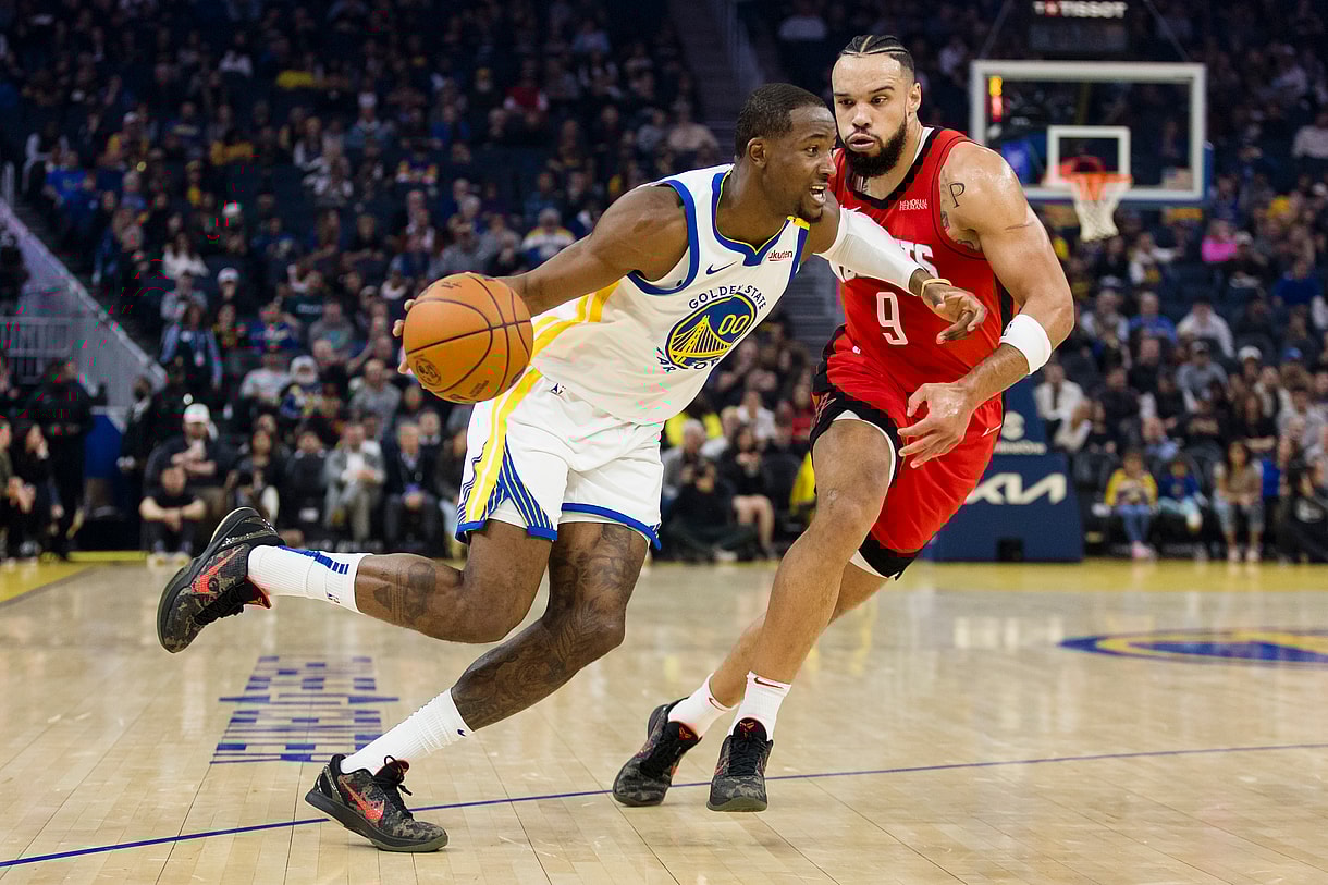 Dec 5, 2024; San Francisco, California, USA; Golden State Warriors forward Jonathan Kuminga (00) drives past Houston Rockets forward Dillon Brooks (9) during the first quarter at Chase Center. Mandatory Credit: John Hefti-Imagn Images