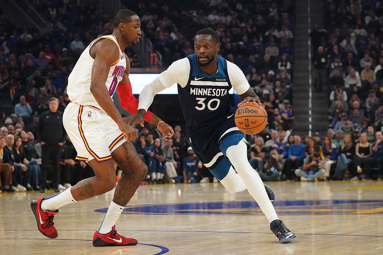 Dec 8, 2024; San Francisco, California, USA; Minnesota Timberwolves forward-center Julius Randle (30) drives to the basket against Golden State Warriors forward Jonathan Kuminga (00) in the first period at Chase Center. Mandatory Credit: David Gonzales-Imagn Images