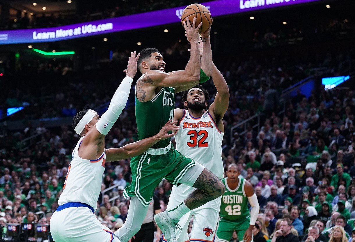 Oct 22, 2024; Boston, Massachusetts, USA; Boston Celtics forward Jayson Tatum (0) drives to the basket against New York Knicks center Karl-Anthony Towns (32) in the second quarter at TD Garden. Mandatory Credit: David Butler II-Imagn Images