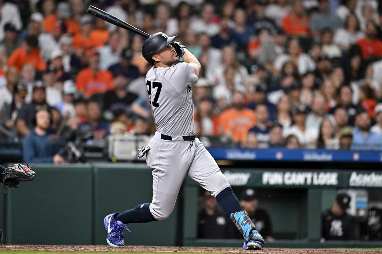 Giancarlo Stanton swings for the Yankees against Houston