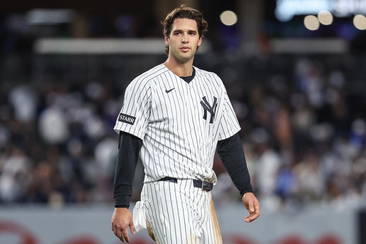 Spencer Jones stands in the outfield for the Yankees against Toronto