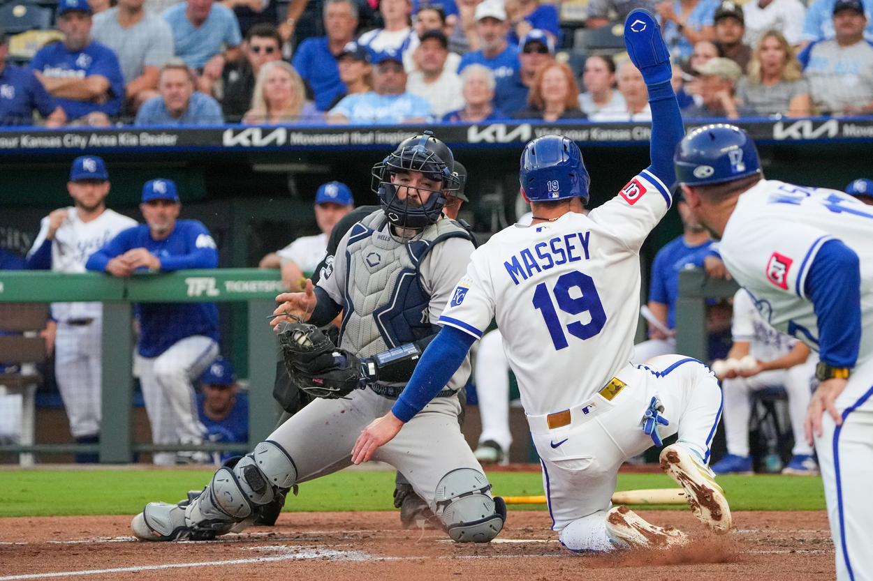 Austin Wells applies a tag at home plate for the Yankees against the Royals