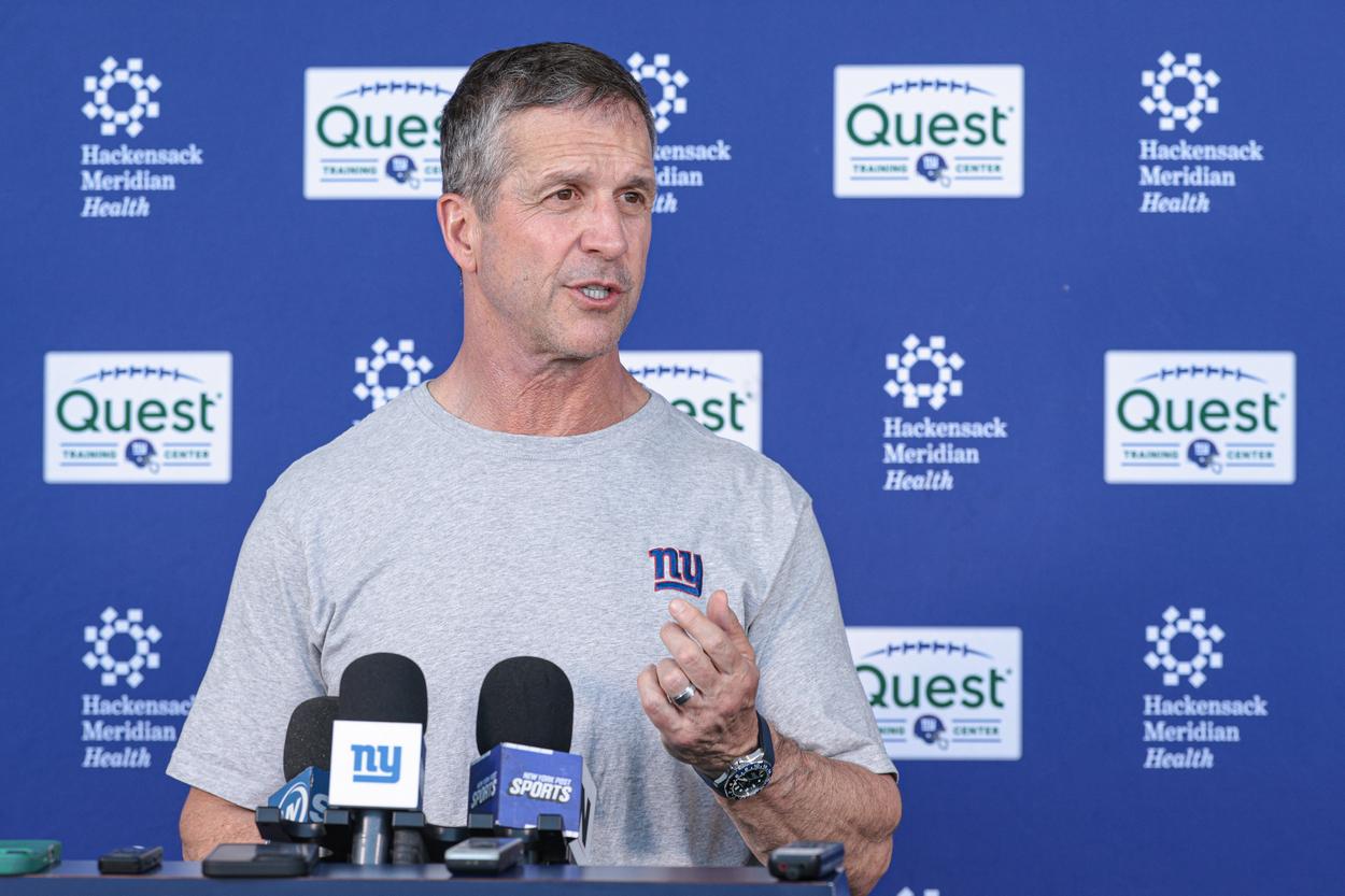 John Harbaugh speaks with reporters after Giants organized team activities
