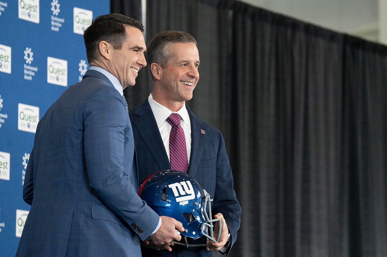 General Manager Joe Schoen and new New Giants Head Coach John Harbaugh hold a NY Giants helmet during a press conference welcoming Harbaugh at the Quest Diagnostics Training Center in East Rutherford on Tuesday, Jan. 20, 2025.