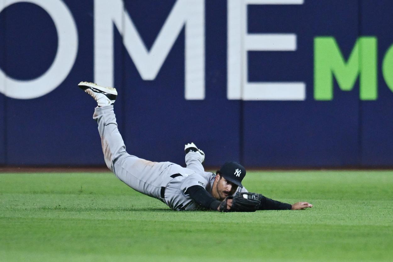 Trent Grisham diving in center field for the Yankees