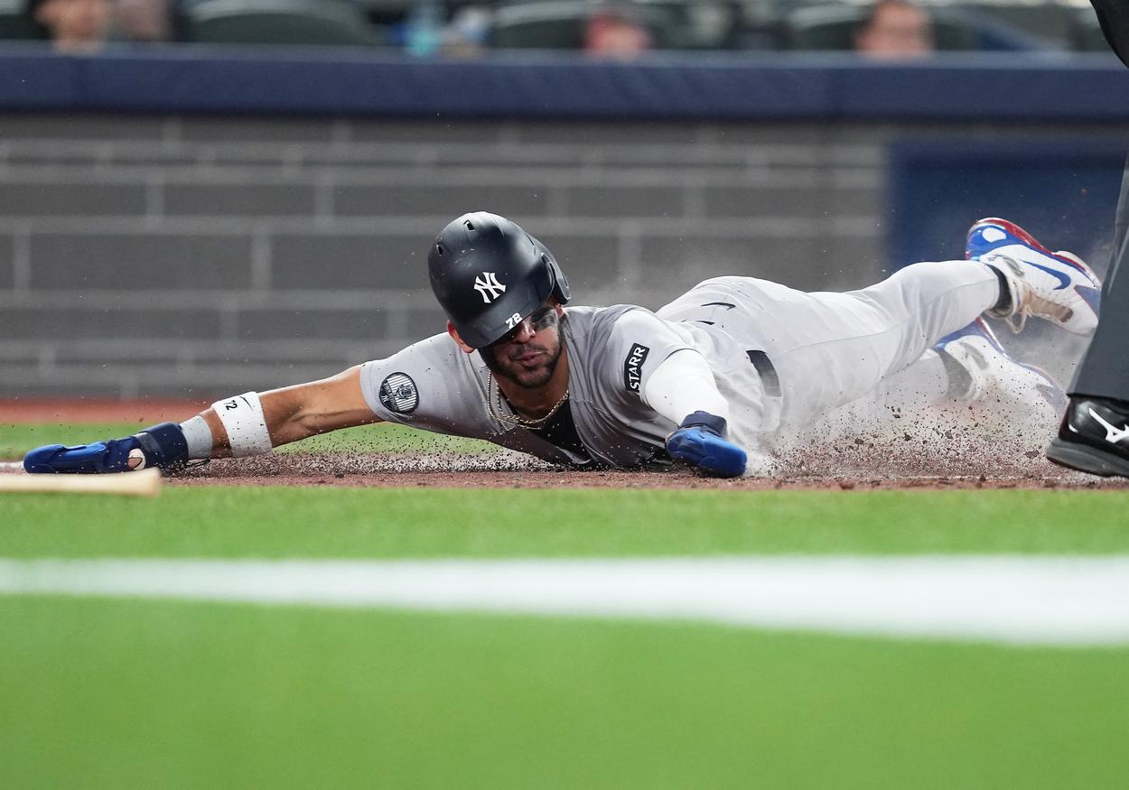 José Caballero scores a run for the Yankees in Toronto