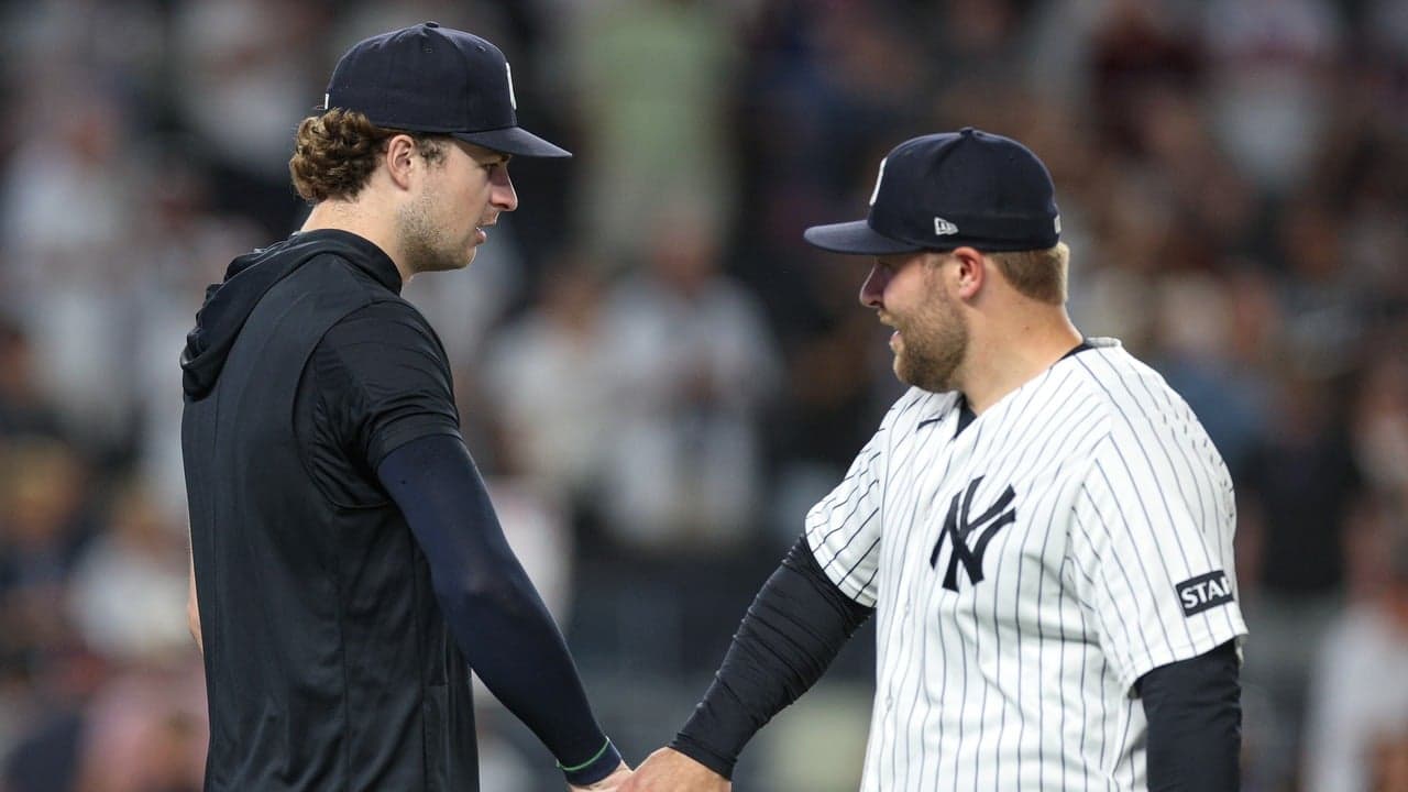 David Bednar talking with a Yankees teammate after a game