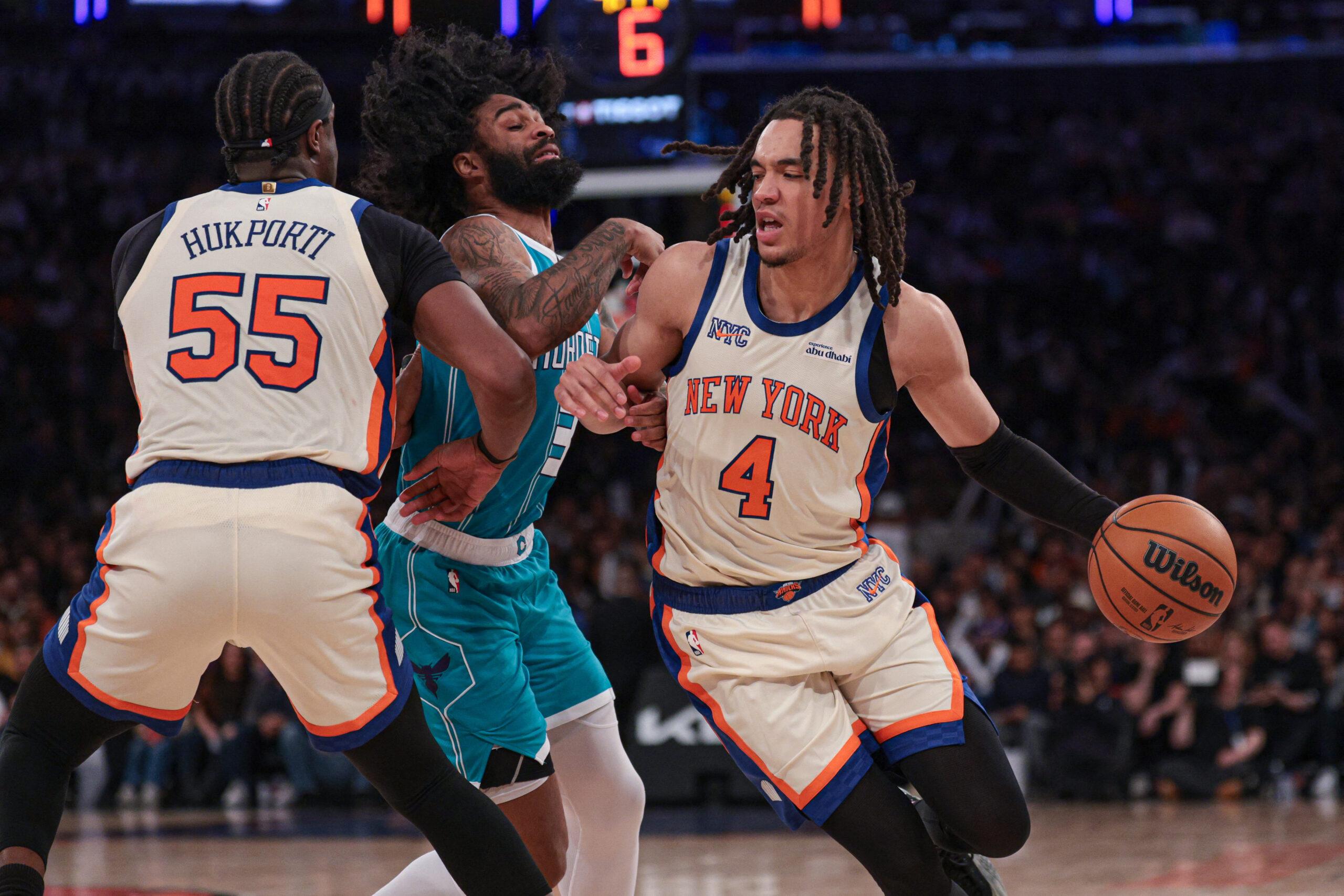 Pacome Dadiet dribbling for the Knicks