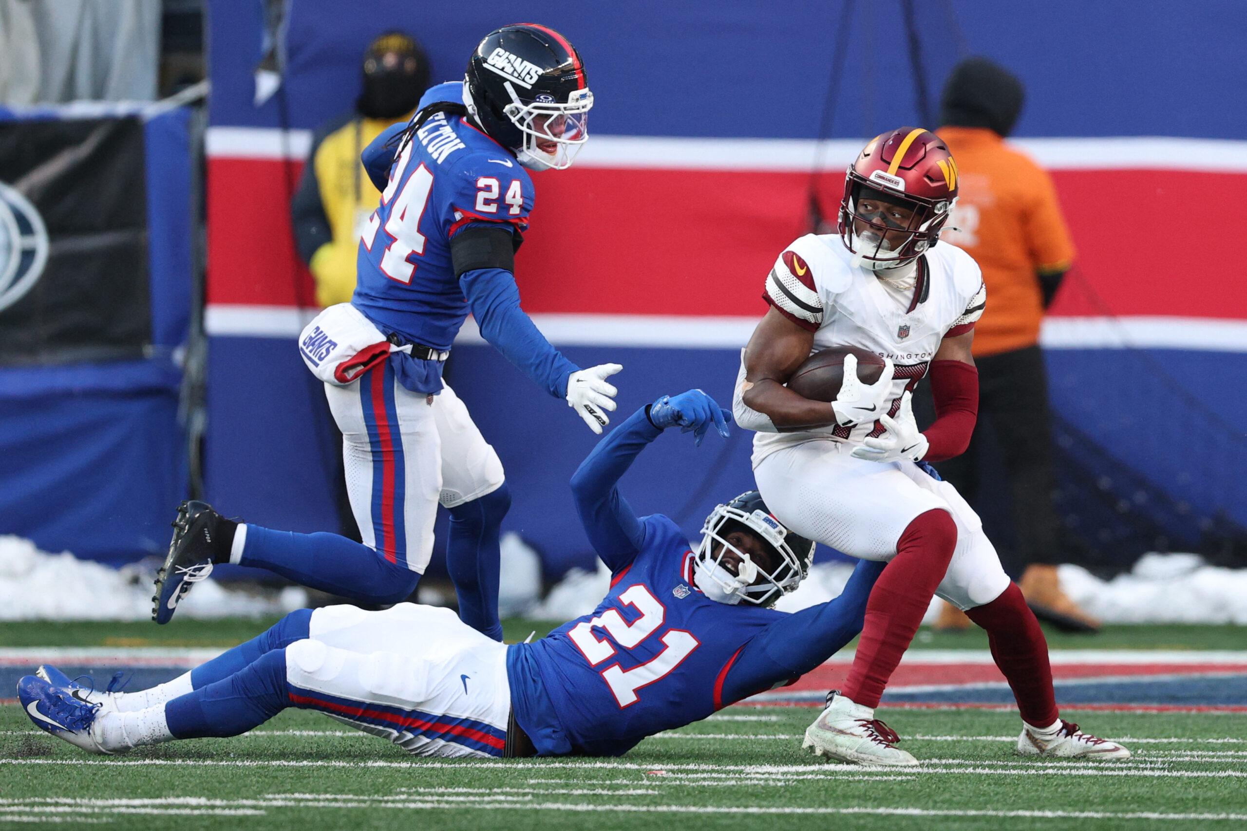Paulson Adebo defending for the Giants