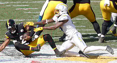Sep 22, 2024; Pittsburgh, Pennsylvania, USA;  Los Angeles Chargers safety Derwin James Jr. (3) sacks Pittsburgh Steelers quarterback Justin Fields (2) during the third quarter at Acrisure Stadium. Pittsburgh won 20-10. Mandatory Credit: Charles LeClaire-Imagn Images