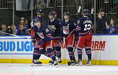 New York Rangers left wing Jimmy Vesey (26) celebrates his goal with center Nick Bonino (12), forward Alexis Lafreniere (13), defenseman K'Andre Miller (79) and defenseman Jacob Trouba (8) during the second period against the Los Angeles Kings at Madison Square Garden