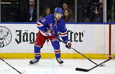 New York Rangers left wing Alexis Lafreniere (13) looks to pass against the Calgary Flames during the third period at Madison Square Garden