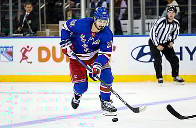 New York Rangers left wing Chris Kreider (20) skates with the puck against the San Jose Sharks during the third period at Madison Square Garden