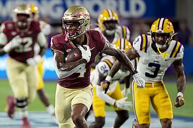 Florida State Seminoles wide receiver Keon Coleman (4) runs the ball for a touchdown during the first half against the Louisiana State Tigers at Camping World Stadium (Giants prospect)