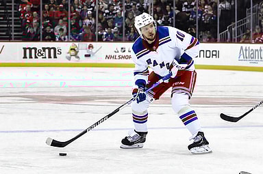 New York Rangers left wing Artemi Panarin (10) looks to pass the puck against the New Jersey Devils during the first period at Prudential Center