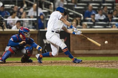New York Yankees are looking into New York Mets' Joe Panik.