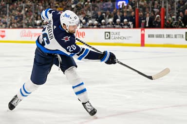 Winnipeg Jets forward Blake Wheeler (26) takes a shot on goal against the Minnesota Wild. New York Rangers, Rangers, NYR