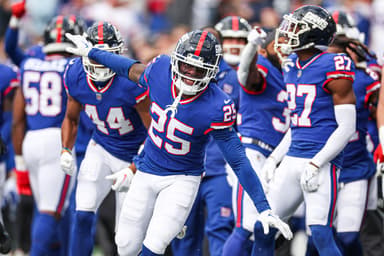 New York Giants cornerback Deonte Banks (25) celebrates after an interception against the Washington Commanders during the first half at MetLife Stadium