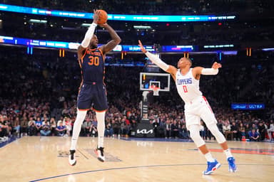 New York Knicks power forward Julius Randle (30) shoots a three point jump shot against Los Angeles Clipper point guard Russell Westbrook (0) during the first quarter at Madison Square Garden