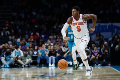 New York Knicks guard RJ Barrett (9) pushes the ball up court against the Charlotte Hornets during the second half at Spectrum Center