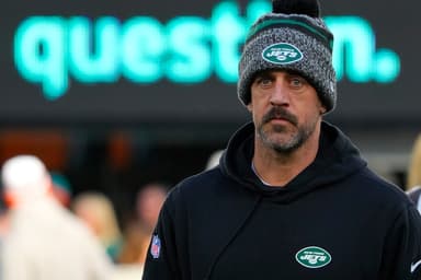 New York Jets quarterback Aaron Rodgers (8), on injured reserve, pregame against the Miami Dolphins at MetLife Stadium
