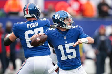New York Giants quarterback Tommy DeVito (15) throws the ball during the first half against the New England Patriots at MetLife Stadium