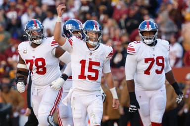New York Giants quarterback Tommy DeVito (15) celebrates after throwing a touchdown pass against the Washington Commanders during the second quarter at FedExField