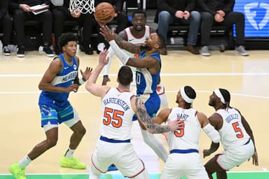 Milwaukee Bucks guard Damian Lillard (0) drives to the basket against New York Knicks defenders in the second half at Fiserv Forum