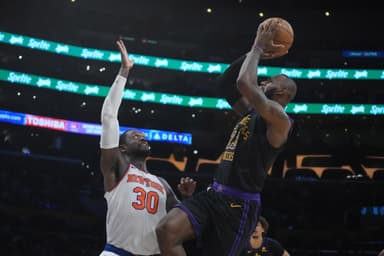 Los Angeles Lakers forward LeBron James (23) shoots the ball against New York Knicks forward Julius Randle (30) in the second half at Crypto.com Arena