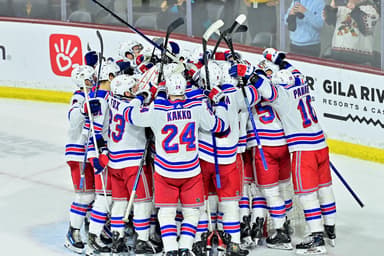 The New York Rangers celebrate after beating the Arizona Coyotes at Mullett Arena
