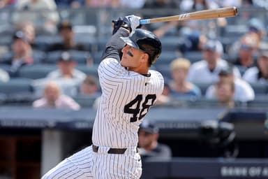 May 23, 2024; Bronx, New York, USA; New York Yankees first baseman Anthony Rizzo (48) follows through on an RBI sacrifice fly against the Seattle Mariners during the seventh inning at Yankee Stadium. Mandatory Credit: Brad Penner-USA TODAY Sports