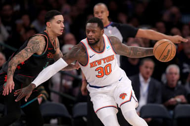 Jan 18, 2024; New York, New York, USA; New York Knicks forward Julius Randle (30) controls the ball against Washington Wizards forward Kyle Kuzma (33) during the third quarter at Madison Square Garden. Mandatory Credit: Brad Penner-USA TODAY Sports