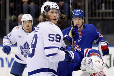 Dec 12, 2023; New York, New York, USA; Toronto Maple Leafs left wing Tyler Bertuzzi (59) watches the puck fly by his head in front of New York Rangers defenseman Braden Schneider (4) and goaltender Igor Shesterkin (31) during the third period at Madison Square Garden. Mandatory Credit: Brad Penner-USA TODAY Sports