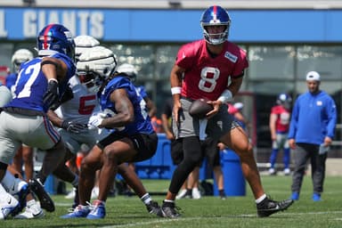 Jul 26, 2024; East Rutherford, NJ, USA; New York Giants quarterback Daniel Jones (8) fakes a handoff during training camp at Quest Diagnostics Training Center. Mandatory Credit: Lucas Boland-USA TODAY Sports