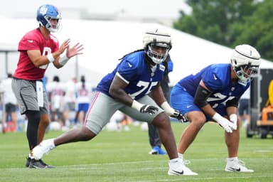 Jul 25, 2024; East Rutherford, NY, USA; New York Giants offensive tackle Joshua Ezeudu (75) participates in a drill during training camp at Quest Diagnostics Training Center. Mandatory Credit: Lucas Boland-USA TODAY Sports