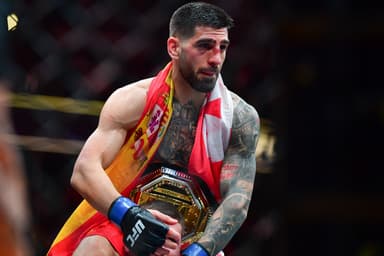 Feb 17, 2024; Anaheim, California, USA; Ilia Topuria celebrates his championship victory against Alexander Volkanovski during UFC 298 at Honda Center. Mandatory Credit: Gary A. Vasquez-Imagn Images