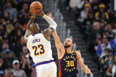 Jan 25, 2025; San Francisco, California, USA; Golden State Warriors guard Stephen Curry (30) defends against Los Angeles Lakers forward LeBron James (23) during the fourth quarter at Chase Center. Mandatory Credit: Darren Yamashita-Imagn Images