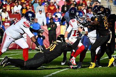 Washington Commanders defensive tackle Daron Payne (94) sacks New York Giants quarterback Tommy DeVito (15) during the first half at FedExField